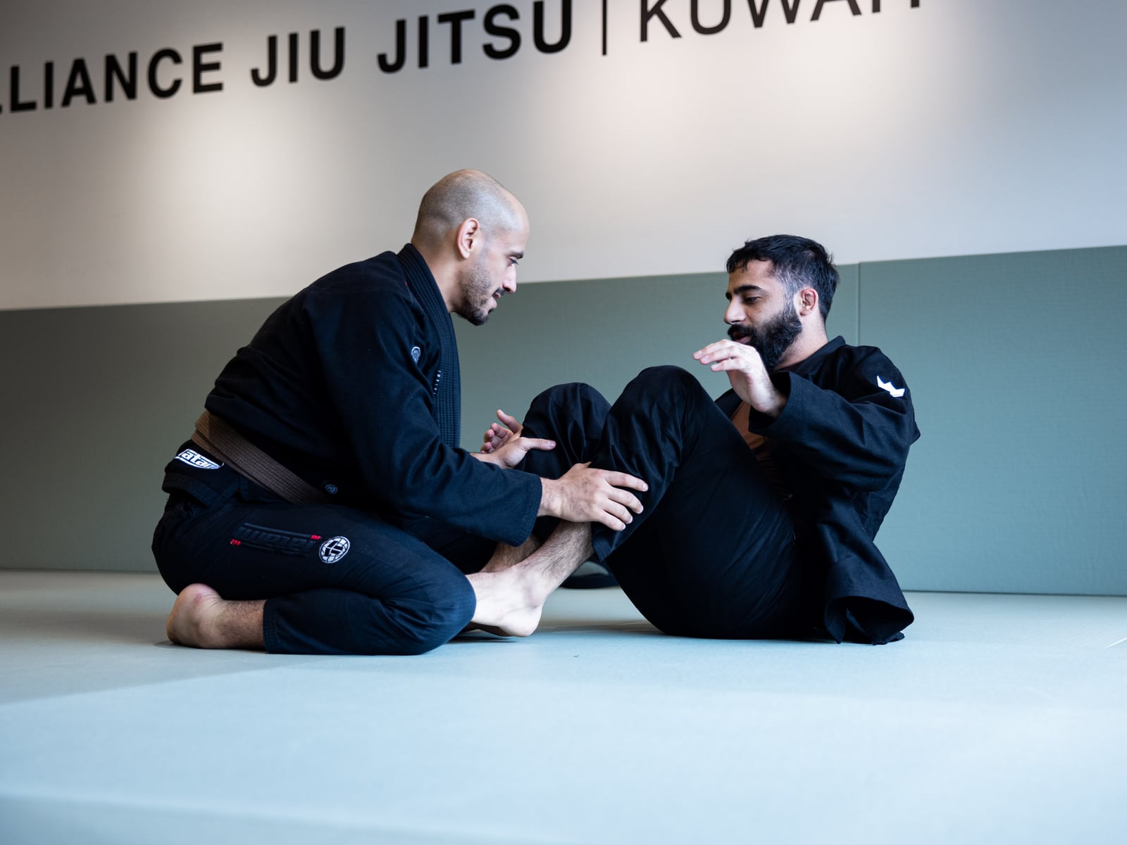 Adults training Brazilian Jiu-Jitsu at Alliance Kuwait